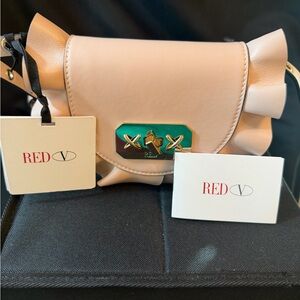Red Valentino Red(v) Rock Ruffles
Belt Bag in pink. BNWTO and dust bag.
